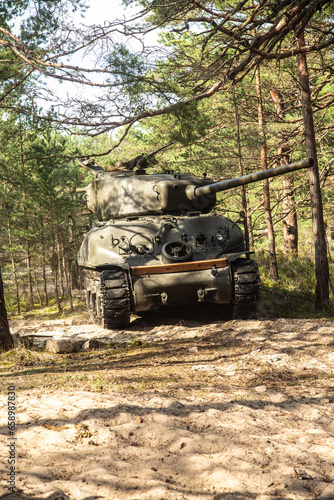 American World War II Sherman tank in the forest.