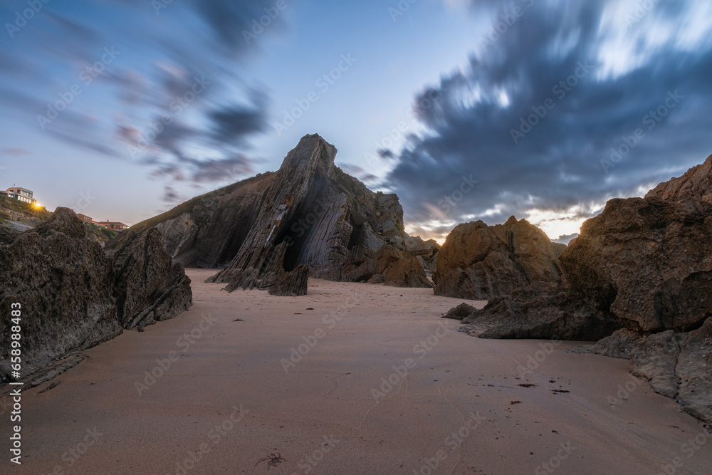 Long exposure shot of Arnia beach in Santander, Cantabria, North Spain with flysch rocks and sandy beach in twilight. Popular travel destination Long exposure shot of Arnia beach in Santander, Cantabria, North Spain with flysch rocks and sandy beach in twilight. Popular travel destination
