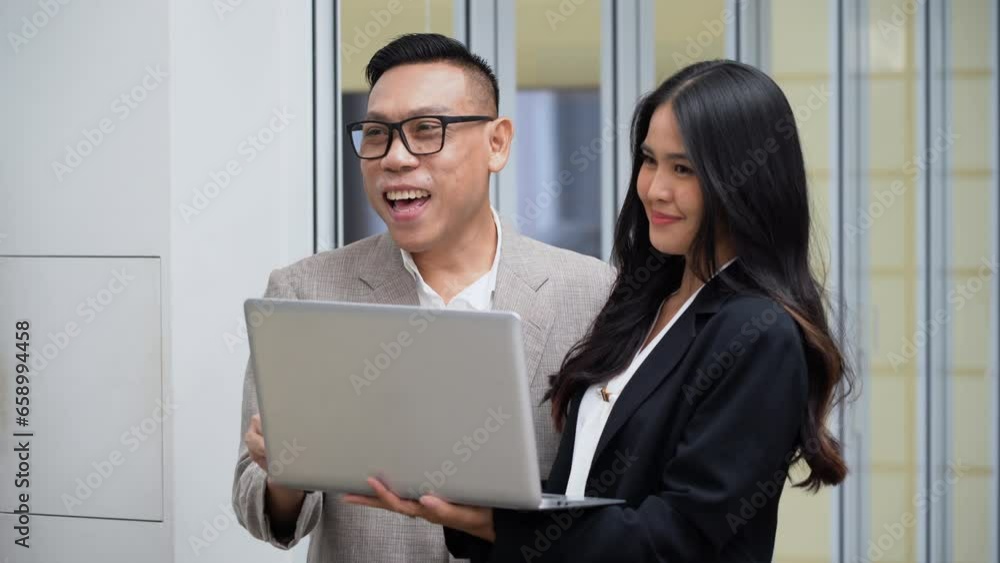 group of asian business people lgbtq manager talking and teaching woman worker with laptop computer in office.