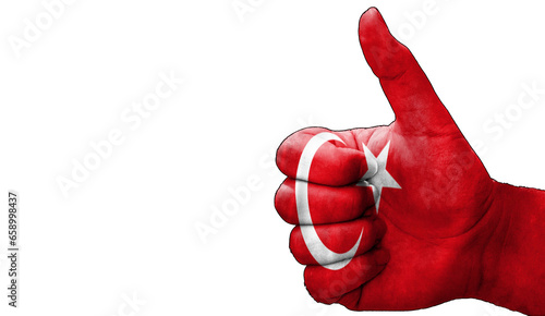 thumbs up in approval with the Turkish flag painted
