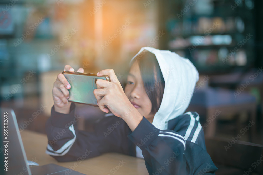 Young woman sitting in a cafe with her laptop, Stressful for work. Young woman sitting in a cafe with her laptop, Stressful for work.