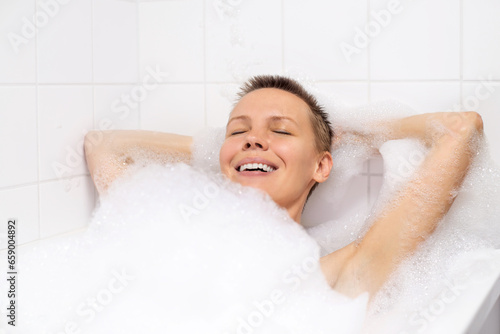 Mature woman enjoying a soothing bubble bath
