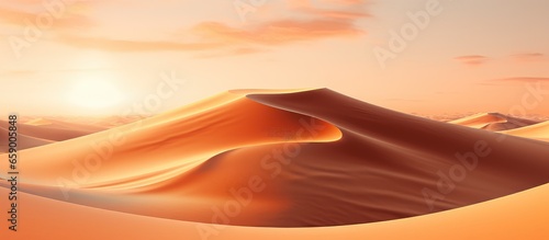 Aerial perspective of desert sand dunes during sunset