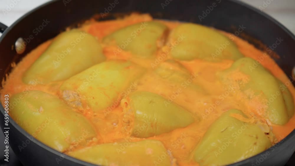 Recipe of homemade stewed stuffed sweet pepper. Selective focus Recipe of homemade stewed stuffed sweet pepper. Selective focus