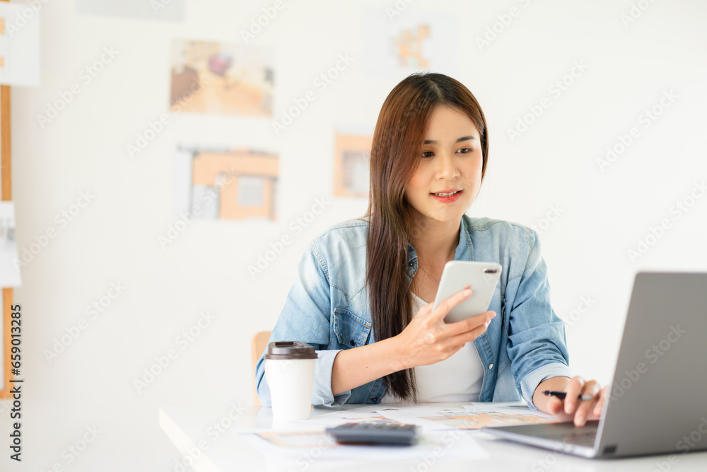 Design building concept, Female architect use laptop and smartphone to drafting house plan project