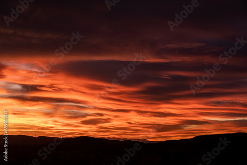 Purple and Orange Rays of Sunlight Over Big Bend Sky © kellyvandellen