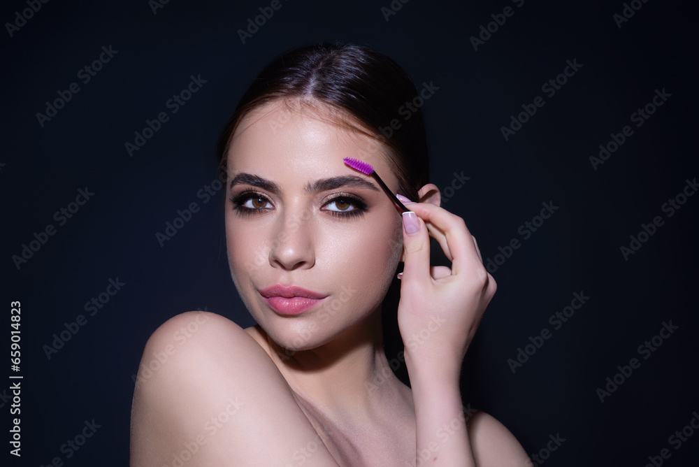 Beautiful woman with perfect shape eyebrows. Womans brows close up. Beautiful girl with eyebrow brush. Eyebrow correction. Long eyelashes and thick eyebrows.