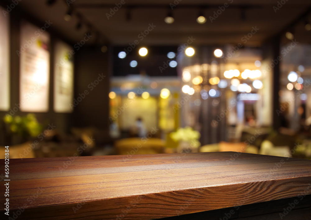 Empty wooden table with bokeh and blur restaurant background, for your photo montage or product display, Space for placing items on the table, product and food display. Empty wooden table with bokeh and blur restaurant background, for your photo montage or product display, Space for placing items on the table, product and food display.