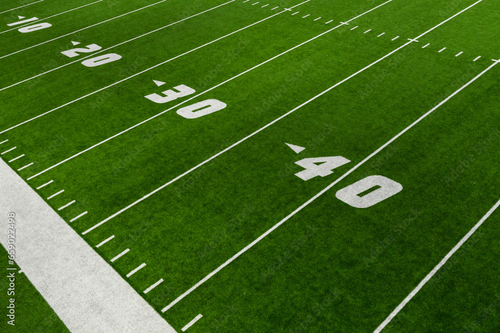 Obraz premium football field green artificial turf with yard lines and numbers