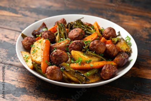 Baked meatballs with Roasted vegetables, potato, carrots, tenderstem broccoli and onions