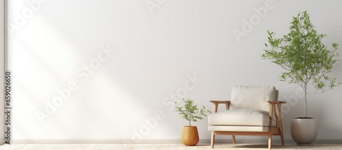 Contemporary minimal interior armchair on blank white wall