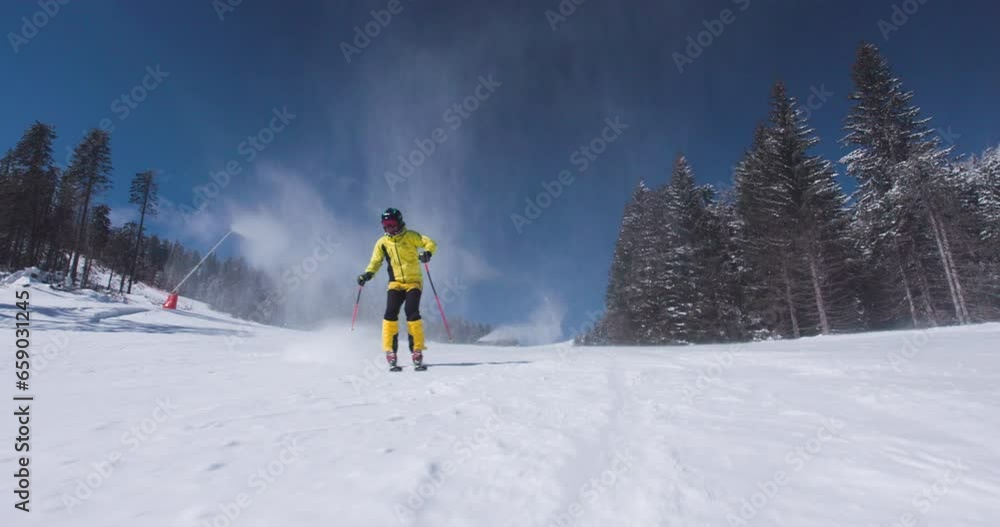 Professional skier skiing on slope on a sunny winter day. Ski instructor recorded on cinema camera at 120fps. Ski run 03 clip 3 of 7. Professional skier skiing on slope on a sunny winter day. Ski instructor recorded on cinema camera at 120fps. Ski run 03 clip 3 of 7.