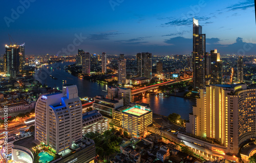 Aerial City view of Bangkok city and subway station Thailand Bangkok skyline and skyscraper with light trails on Sathorn Road center of business in Bangkok downtown. Bangkok Thailand