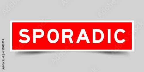 Sticker label with word sporadic in red color on gray background