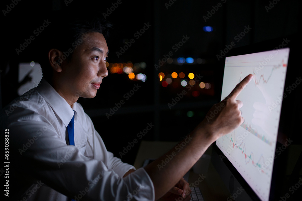 White collar worker working late at night.