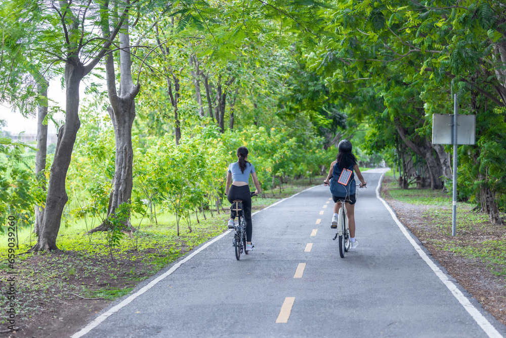 Fototapeta premium Biker fuse eco-awareness, cycling for fitness, solar for device power, and recycling into lifestyle