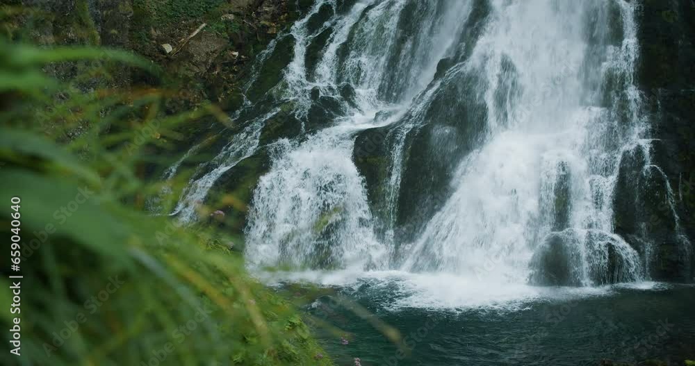 Clear spring water of mountain waterfall in Alps. Gollinger Wasserfall in Austria. Stunning view of wild, powerful stream in green forest. Clear spring water of mountain waterfall in Alps. Gollinger Wasserfall in Austria. Stunning view of wild, powerful stream in green forest.