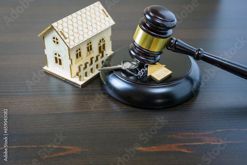 House keys and judge gavel. Concept purchase sale, rent, auction, mortgage. The arrest of property, the imposition of restrictions. Real estate and law concept