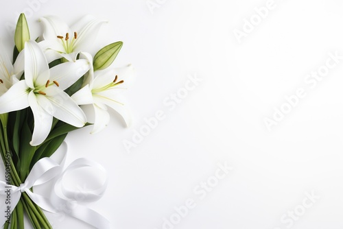 White lily bouquet with ribbon on white background.Funeral Concept