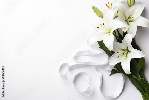 White lily bouquet with ribbon on white background.Funeral Concept