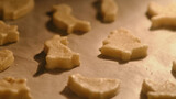 Process of baking cookies from puff pastry in the oven. Cooking cookies in the shape of a heart, an Easter bunny and other animals