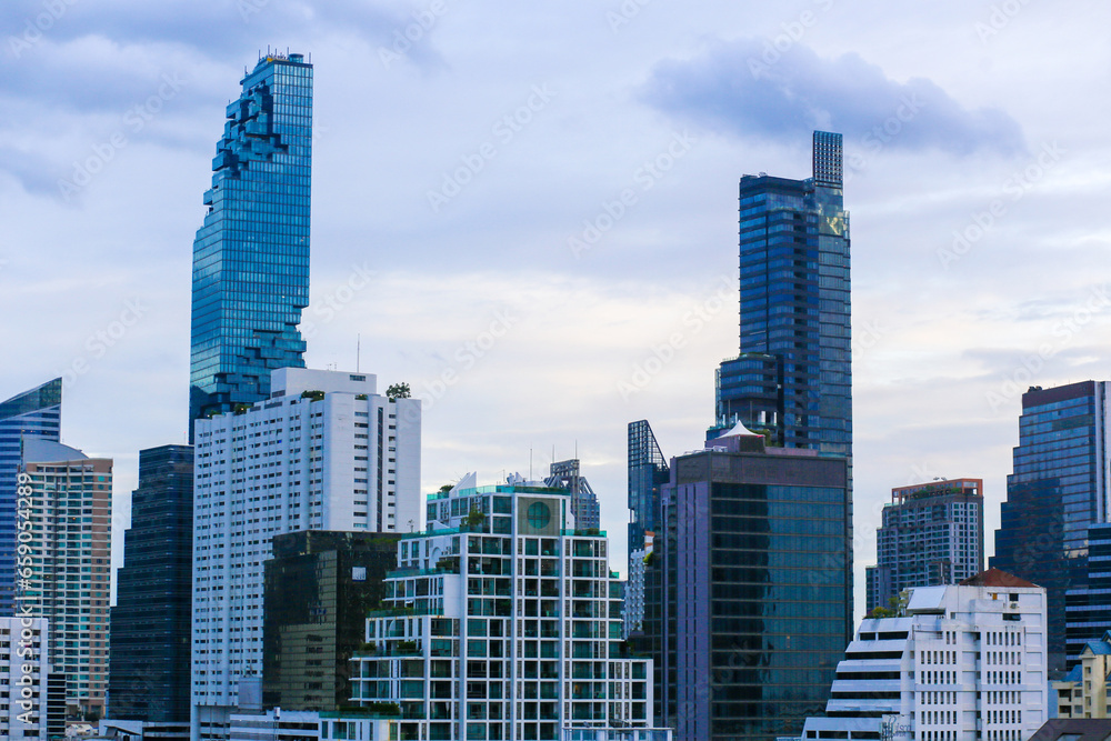 Fototapeta premium Aerial view of Mahanakhon building and other high building in Bangkok City on the sunny day