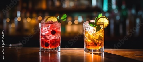 Two summer cocktails on a bar Focus on the glasses