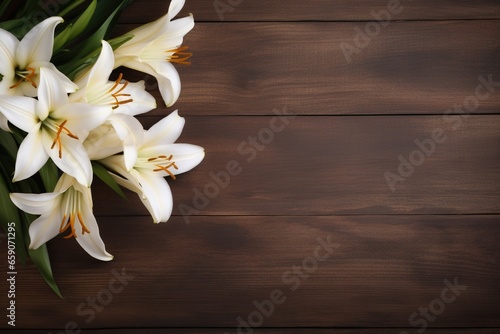 White lily flowers on wooden background. Top view with copy space.Funeral Concept