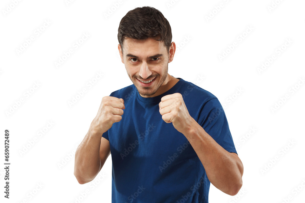 Confident sporty man in blue t-shirt holding fists in front of him, ready to fight and defend himself Confident sporty man in blue t-shirt holding fists in front of him, ready to fight and defend himself