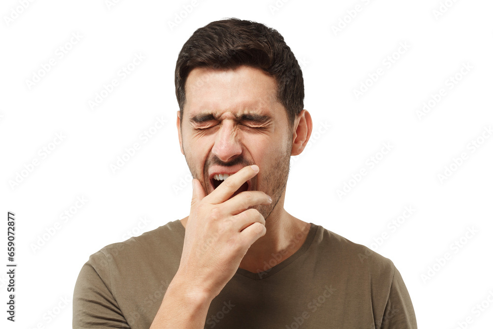 Sleepy young man yawning, waking up, closing his mouth with hand Sleepy young man yawning, waking up, closing his mouth with hand