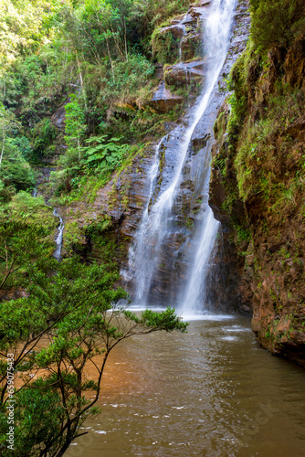 Beautiful waterfall among the dense vegetation of rainfoest and rocks in the state of Minas Gerais  Brazil