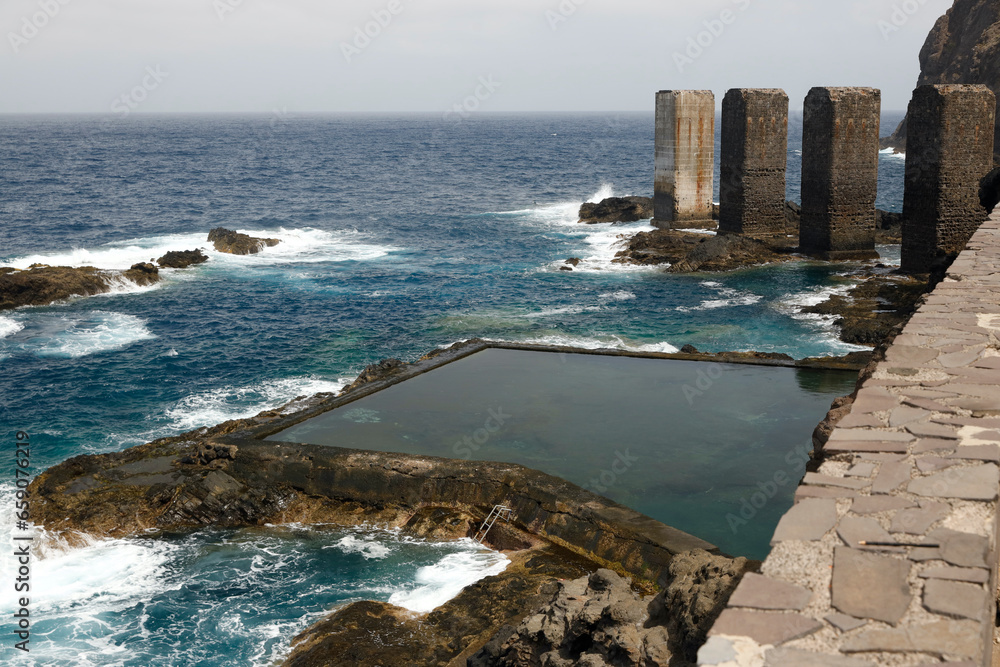 Obraz premium La Gomera, Spain. View of the dilapidated banana loading station in Hermigua, located on the Atlantic Ocean.