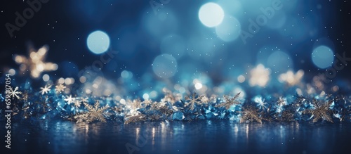 Festive blue background with twinkling stars and snowfall