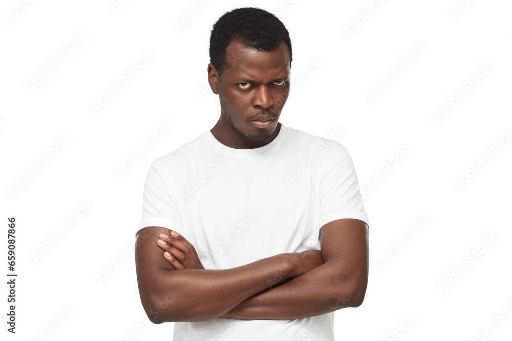 Angry african american man, evil black guy looking at camera with anger, standing with arms crossed Angry african american man, evil black guy looking at camera with anger, standing with arms crossed