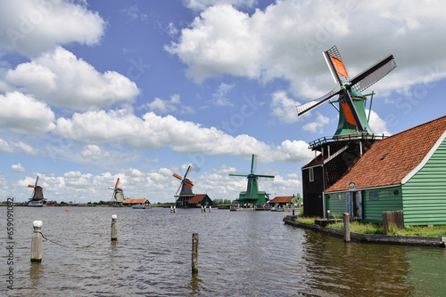dutch windmills village seen from water, netherlands 