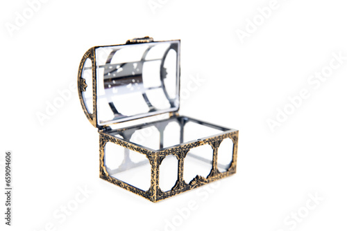 Small gold and glass treasure chest open and isolated over white angled view