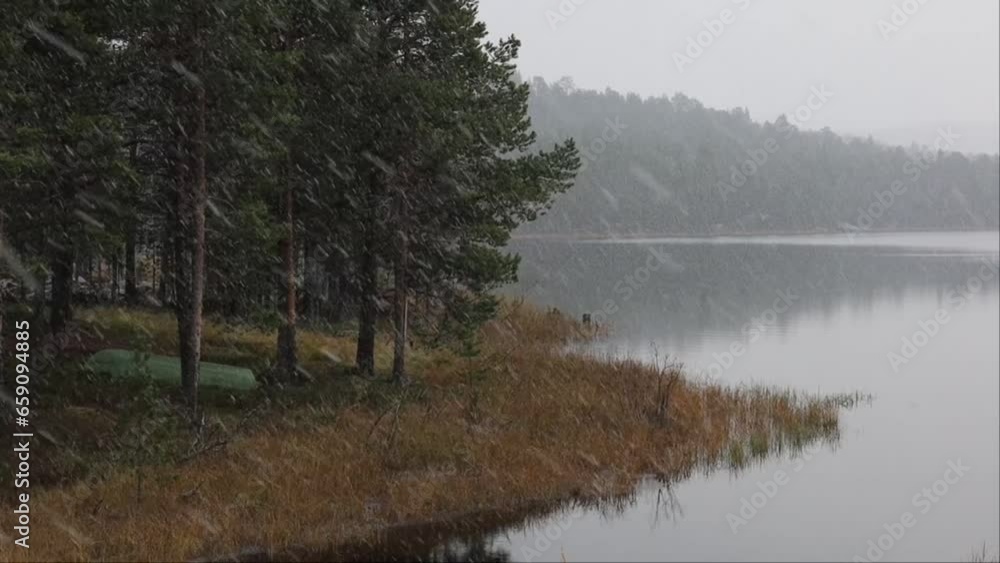 Inari, Finland Snow falls over Lake Inari in winter. Inari, Finland Snow falls over Lake Inari in winter.