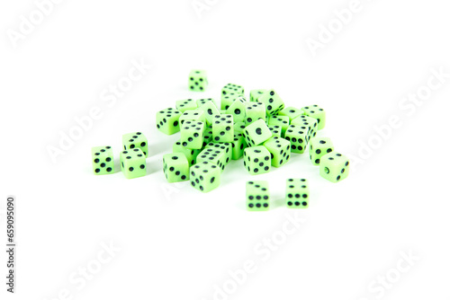 Tiny green neon dice pile isolated over white