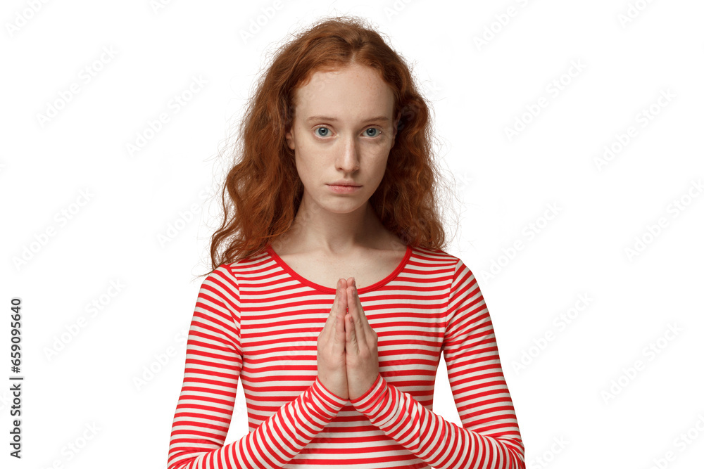 Religious redhead girl praying to god, begging for the bright future Religious redhead girl praying to god, begging for the bright future