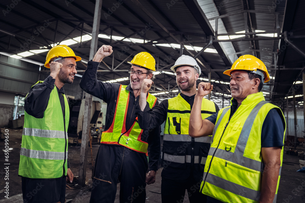 Team engineers and foreman stack hand and shake hands to show success at factory machines. Mechanical Team Operating Machinery. Team engineers and foreman stack hand and shake hands to show success at factory machines. Mechanical Team Operating Machinery.
