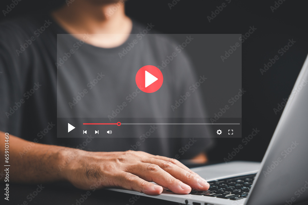 Man watching a live stream on the internet. Conceptual image of online video streaming with a multimedia player on the screen. Stay entertained and informed with digital media. - obrazy, fototapety, plakaty 