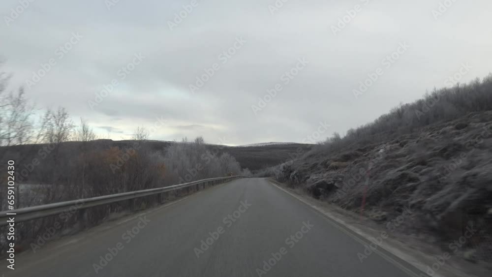 Utsjoki, Finland Late fall and early winter driving conditions on an icy road in Finnish Lapland. Utsjoki, Finland Late fall and early winter driving conditions on an icy road in Finnish Lapland.
