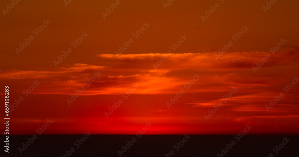 Russia. North Caucasus, Karachay-Cherkessia. View of the rising sun from the Bolshoy Bermamyt plateau.
