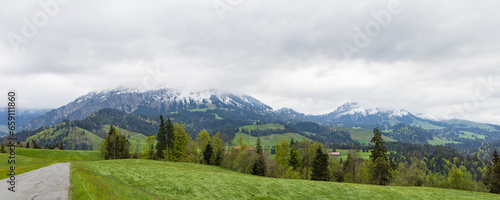 Panoramic view of Emmental valley with snowy mountains in canton Bern in Switzerland