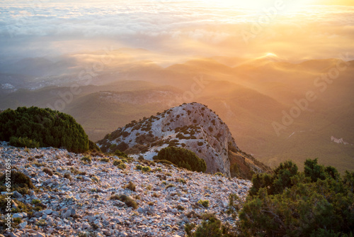 View from Morrón de Alhama in the Sierra Espuña natural park, Region of Murcia, Spain with a sea of ​​clouds in the background at sunrise photo