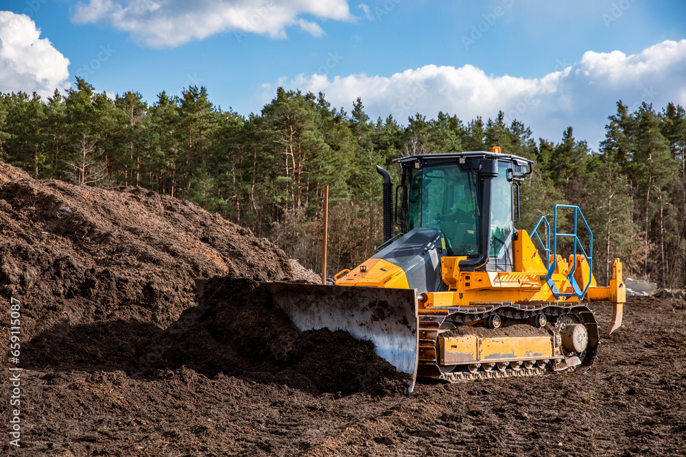 Bulldozer (crawler dozer) at work in the field. Bulldozer (crawler dozer) at work in the field.