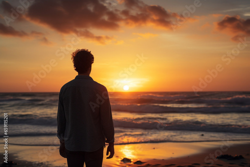 a man standing and looking at the sky at the seaside