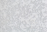 Light background of decorative plaster. Rough surface