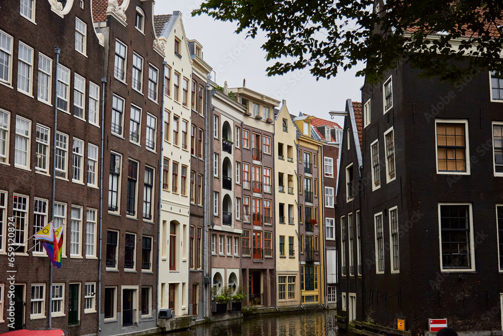 Canal with beautiful houses on canal shores, selective focus
