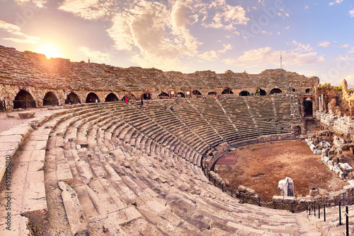Fototapeta Naklejka Na Ścianę i Meble -  Ancient theatre ruins in Side, Turkey at Sunset. Popular tourist destination in Turkey.